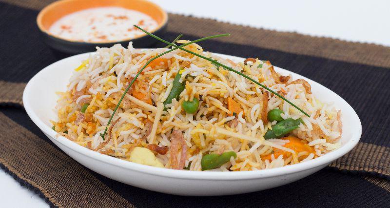 Nizami Tarkari Biryani · Long grain aged basmati rice cooked on dum with vegetables and aromatic spices, served with raita. Dishes may contain nuts, gluten or lactose based products, please consult your server before ordering.