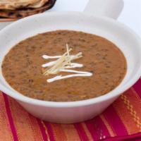 Lalla Mussa Dal · signature style black lentils simmered overnight on slow fire. Signature.