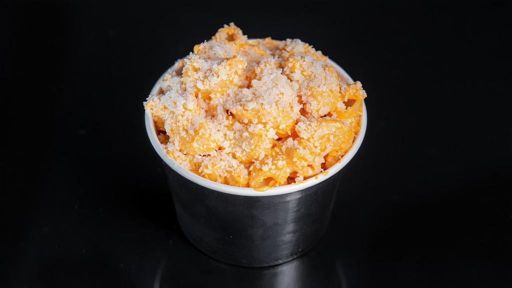 Sam's Buffalo Mac n' Cheese · Macaroni in a 3 cheese blend sauce, topped with parmesan and our spicy buffalo sauce