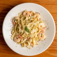 Sensational Shrimp Pasta · Fettuccine with creamy garlic sauce, parmesan cheese, shrimp, parsley.
