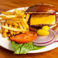Classic Cheeseburger · Homemade sesame bread, mayonnaise, American cheese, red onions, tomatoes, lettuce, yellow ch...