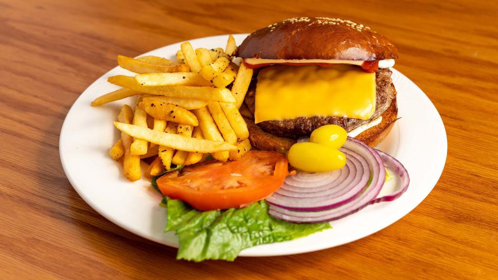 Classic Cheeseburger · Homemade sesame bread, mayonnaise, American cheese, red onions, tomatoes, lettuce, yellow chili pepper.