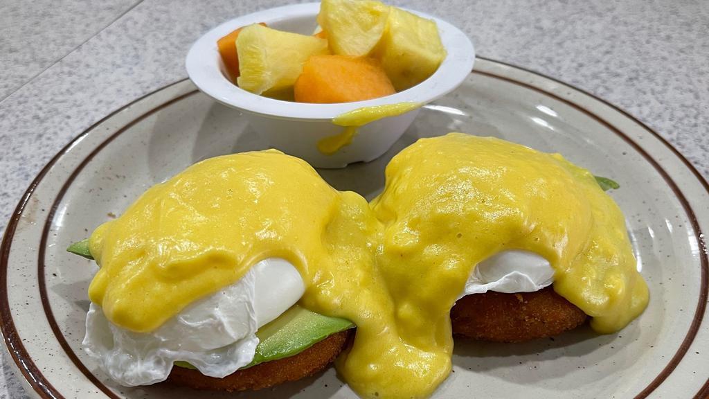 Crab Cake Benedict · Two crab cakes topped with avocado, poached eggs, and hollandaise sauce. No English muffin.