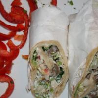 Gyros Sandwich · Combined roasted  Lamb and Beef served with lettuce, tomato and onions on fresh baked pita b...