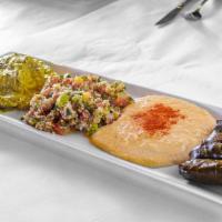 Combination Platter · Vegetarian, gluten free. Hummus, babaganoush, tabbouleh, and dolmas served with homemade pit...