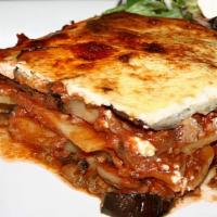 Mousaka · Gluten free. Layers of eggplant and ground beef  served with roasted garlic mashed potato , ...