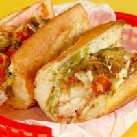 Turkey Breast · Grilled sliced turkey breast, onions, bell peppers, tomato, and cheese.