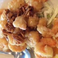 Honey Walnut Prawns · House Favorite! Battered-fried prawns smothered in a creamy white sauce and topped with our ...
