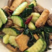 Basil Vegetable Trio · Button mushrooms, zucchini and fried tofu sautéed with thai basil.