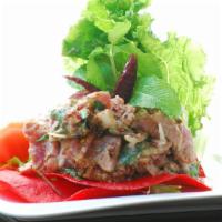 Ahi Tuna Larb · Seared ahi tuna in roasted rice powder, chili, and spicy lime sauce with a touch of fresh mi...