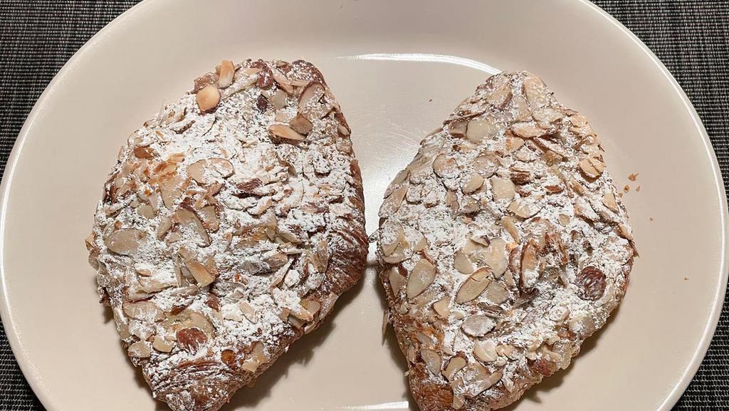 Almond Croissant · This is a classic version of the breakfast pastry with a sweet almond filling or frangipane swirled throughout the dough and topped with toasted almonds baked right into the top.
