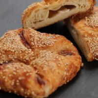 Turkey & Brie Croissant · Made with our classic croissant dough, topped with Turkey followed by Brie Cheese divided eq...