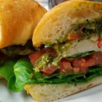 Caprese Chicken Sandwich · Baby spinach, red onion, tomato, basil, mozzarella, pesto, ciabatta bread.