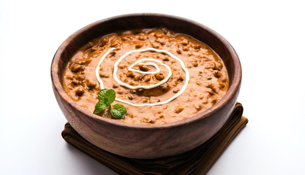 Dal Makhani · 12oz Black Lentils and kidney beans mixed with tomato gravy and special blend of masala.