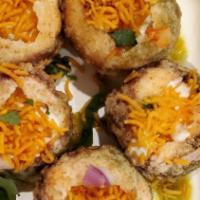 Dahi Sev Puri (Dahi Battata) · Semolina puri puffs filled with potato, chana, onion, chutney, yogurt, sev and cilantro.   N...