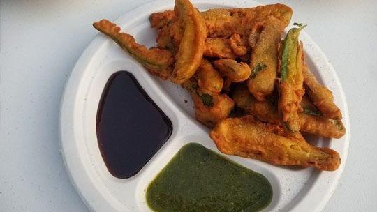 Chilly Pakora · Besan batter chili peppers deep fried with side of chutneys.