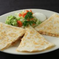 Quesadilla · Corn or flour tortilla and your choice of shredded beef, chicken, or ground beef served with...