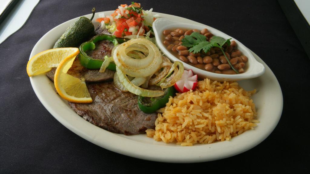 Carne Asada Dinner with rice and beans · Served with rice, beans , sour cream, guacamole, pico de gallo and flour or corn tortillas.