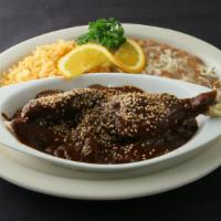 Chicken Mole with rice and beans · Chicken Mole Poblano Served with rice, beans and flour or corn tortillas.