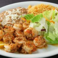 Shrimp Al Mojo De Ajo (Garlic style) Plate · Rice, beans , side salad & choice of tortillas
