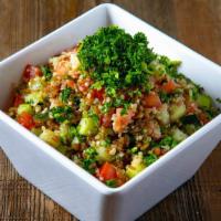 Quinoa Salad · Quinoa, freekeh, tomato, cucumber, and lemon olive oil dressing on the side.