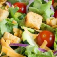 House Salad · Romaine lettuce mix, cucumbers, shredded cheese, tomatoes, onions and garlic croutons tossed...