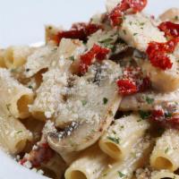 Pasta Milano · 444 cal. Roasted chicken, sun dried tomatoes, mushrooms, rigatoni, roasted garlic cream sauce.