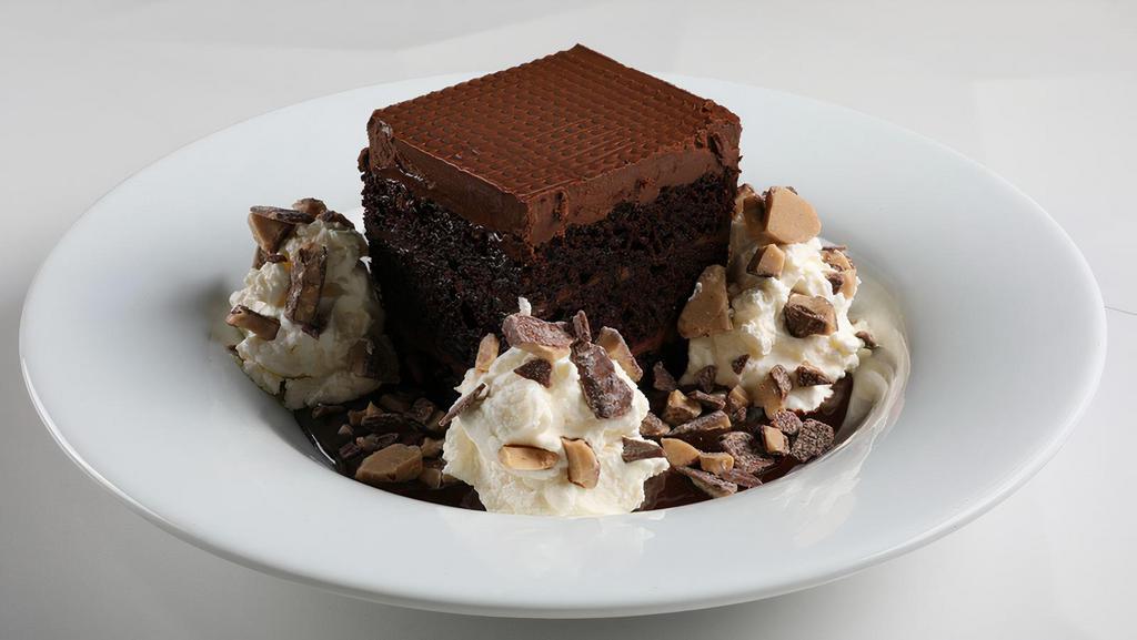 Decadent Chocolate Cake · Intensely rich chocolate cake,layered chocolate ganache,chocolate buttercream, whipped cream, toffee crumbles (538 cal.).