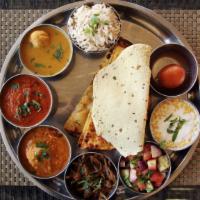 The Pulka Thali · Phulka thali served with 3 pieces. Side of dal (lentil soup), vegetarian curry of the day, s...