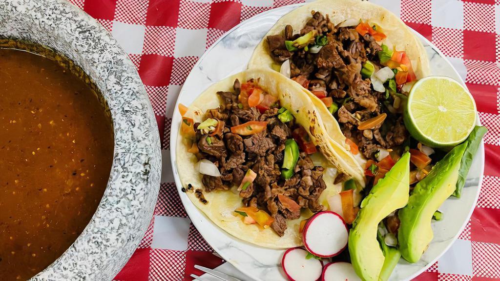 Tacos · Your choice of meat (asada, carnitas y pollo), tortilla, topped with onions, cilantro, pico de gallo, cheese and lettuce.