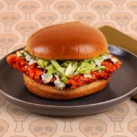 Buffalo Fried Chicken Sandwich · Spicy buffalo fried chicken thigh with blue cheese and lettuce on a buttery brioche bun.