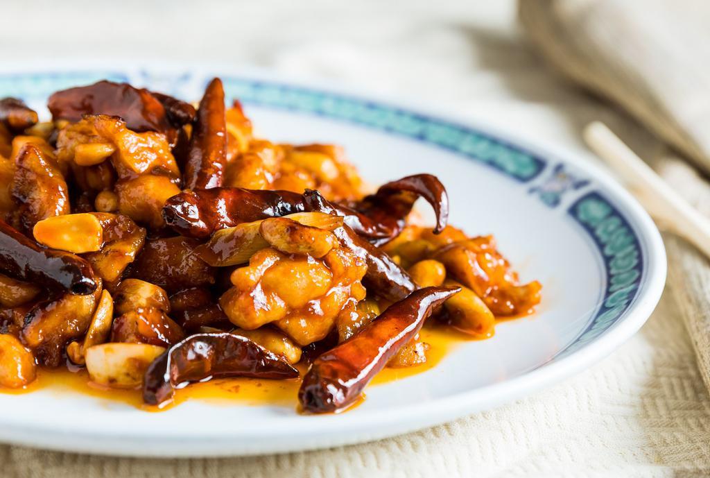 Kung Pao Chicken · Spicy. Diced Chicken Sautéed W/ Dried Whole Chili Pepper, Green Onion & Peanuts.