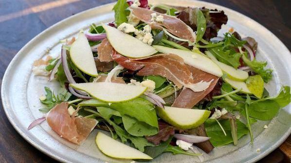 Prosciutto Pear Salad · Mixed organic greens, prosciutto, pear, and gorgonzola with a lemon olive oil dressing.