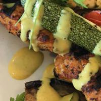 Chicken Skewer · Grilled free-range chicken breast, seasoned with Mediterranean spices, and served over a bed...