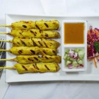 Chicken Satay · Barbeque tender chicken marinated over night, grilled, served with cucumber sauce and peanut...