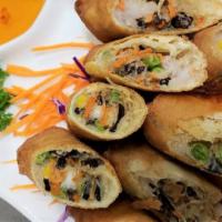 Baan Thai Spring Rolls · Egg rolls stuffed w/ mixed vegetables, silver noodles, deep fried and served w/ sweet & sour...