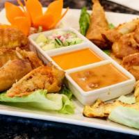 Baan Thai Combo · A combination of spring rolls, chicken satay, pumpkin tod and potatoes tod.