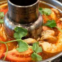 Tom Yum Prawns  · A tasty hot and sour soup with prawns, mushrooms, tomato, and lemongrass.