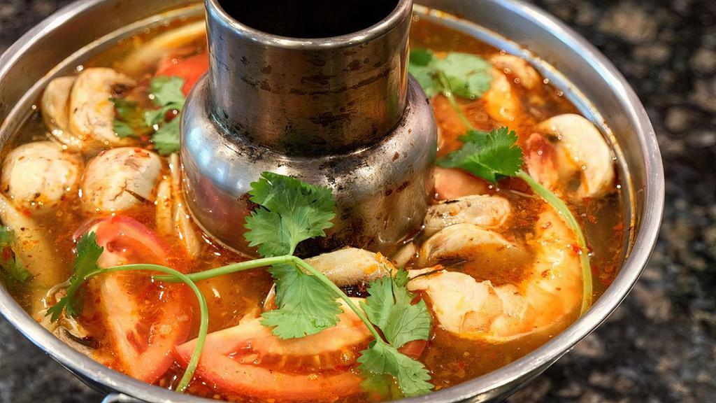 Tom Yum Prawns  · A tasty hot and sour soup with prawns, mushrooms, tomato, and lemongrass.