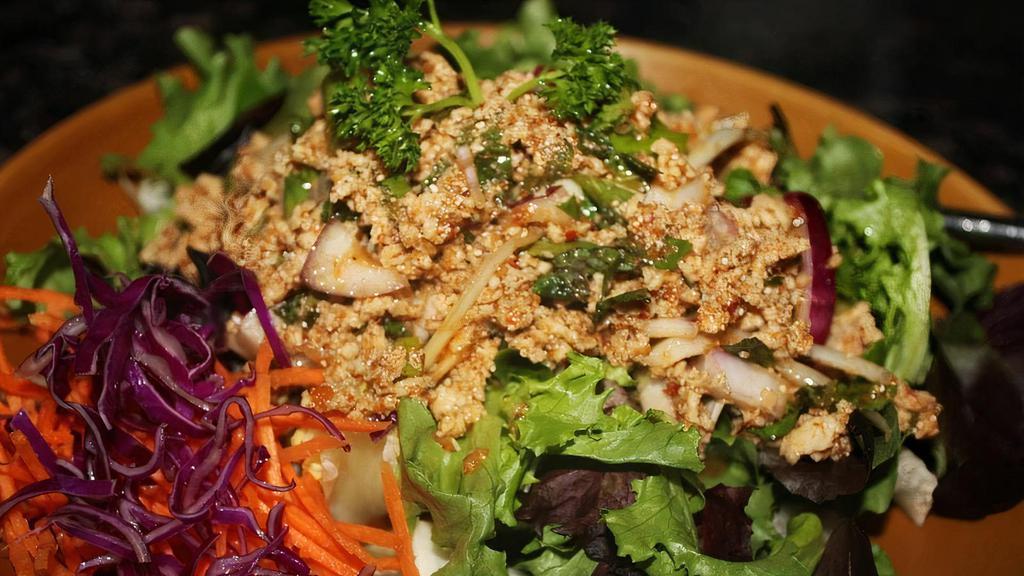 Chicken Salad (Larb) · Minced chicken mixed with chopped onion, lime juice, crushed tossed rice, served with organic green salad.