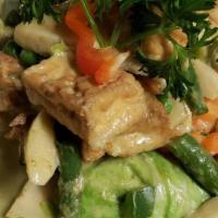 Green Curry · Homemade green curry with coconut milk, bamboo shoots, eggplant, bell pepper & basil.