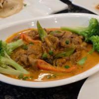 Panang curry chicken · A think Panang curry paste with coconut milk, bell pepper ,basil,  and broccoli