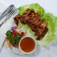 B.B.Q. Pork · Barbequed pork marinated with Thai herbs served with sweet and sour sauce.