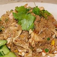 Kao Pad · Thai style fried rice with garlic, egg, onion, peas, tomato, carrot, served with cucumber.