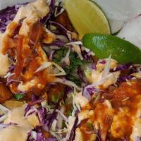 Fried Fish Taco · Corn tortillas, red and green cabbage, sour cream, fresh salsa.