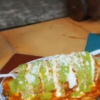 Special Mojado Burrito · Wet burrito any meat, rice, beans, topped with enchilada sauce, melted cheese, guacamole, so...