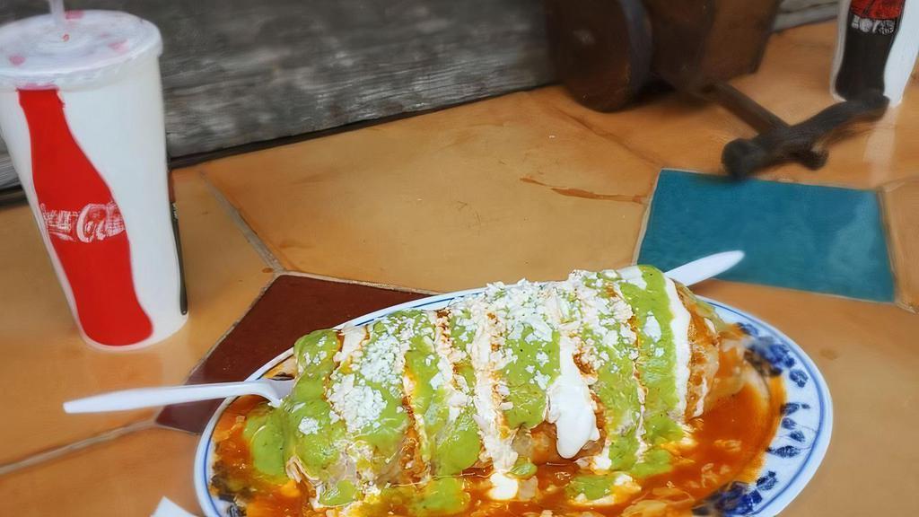 Special Mojado Burrito · Wet burrito any meat, rice, beans, topped with enchilada sauce, melted cheese, guacamole, sour cream, salsa.