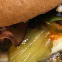 LARA CROFT · Grilled Chicken/Muenster Cheese/Fried Egg/Grilled Onions/House Pickles/Leafy Greens/Bacon/Ho...