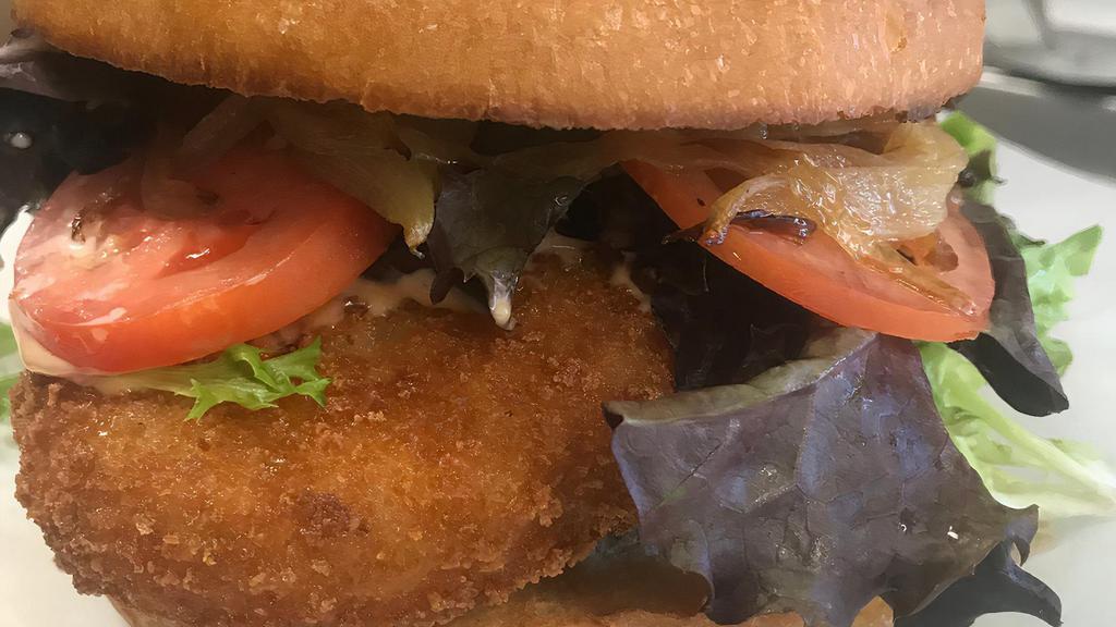 CRABBY PATTY · Two Breaded Crabcakes / Leafy Greens / Grilled Onions / Tomatoes / Sriracha Mayo Sauce / Brioche Bun
