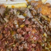 Jurassic Fries · Bed of Fries layered with our Ribeye Steak melted with Shredded Cheese and Grilled Onions al...